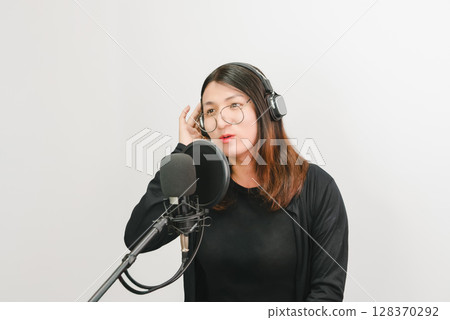 Woman (LGBTQ) singer sing a song with microphone 128370292