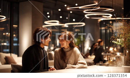 Lovers chatting in a relaxed atmosphere | Night cafe photos capturing a realistic and natural atmosphere 128371354