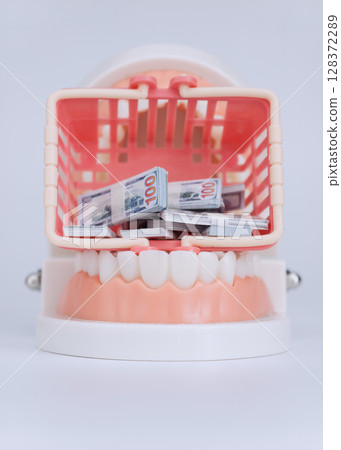 High cost of dental care concept image 128372289