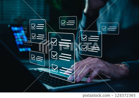 Online assessment and survey concept. A person interacts with virtual checklist on laptop, symbolizing online assessments, surveys, exams, or quizzes. digital evaluation and data collection. fill out, 128372365