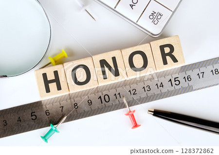 The HONOR concept word is assembled from wooden cubes. ethics, respect, code, honesty, integrity concept The HONOR concept word is assembled from wooden cubes. ethics, respect, code, honesty, integrity concept 128372862