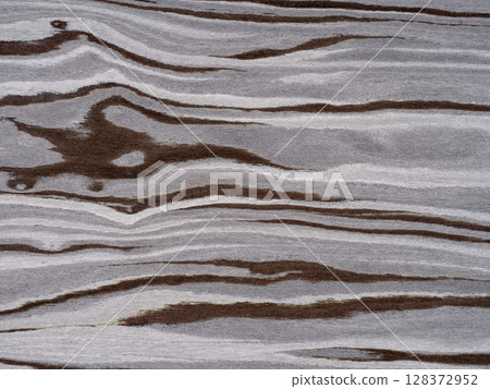 Fossil forest veneer surface with flowing lines in earthy espresso and misty grey tones. Fossil forest veneer surface with flowing lines in earthy espresso and misty grey tones. 128372952