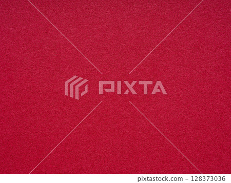 Velvet whispers in the shade of crimson, where the texture beckons to the touch with a silent promise of warmth 128373036