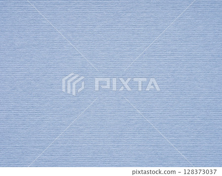 A serene blue paper texture, reminiscent of a tranquil sky, whispers of calm and quiet repose 128373037