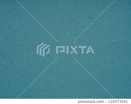 Swept in a sea of teal, the paper texture reflects the tranquil depths and serene mysteries of ocean waters Swept in a sea of teal, the paper texture reflects the tranquil depths and serene mysteries of ocean waters 128373041
