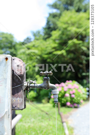 Old outdoor faucet Old outdoor faucet 128373105