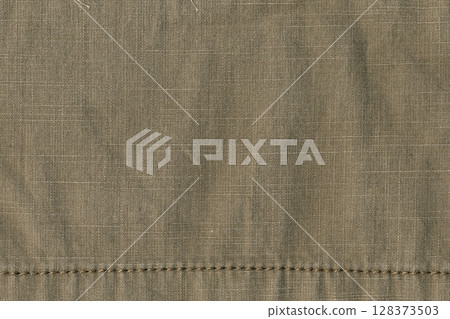 Natural linen textile texture as a background Natural linen textile texture as a background 128373503