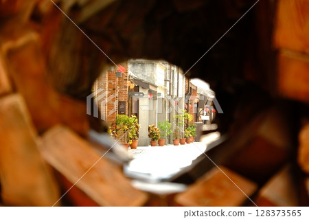 Old town view through a peephole 128373565