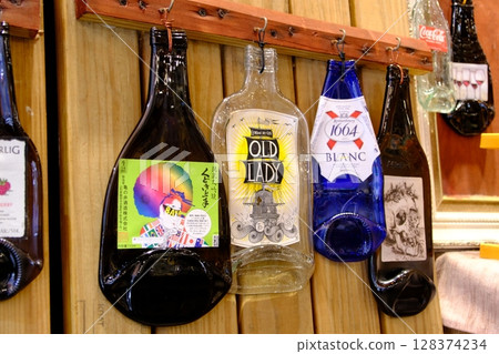 Bottles hanging on the wall 128374234