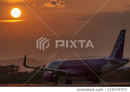 Sendai Airport at dusk, airplane taking off, Natori City, Miyagi Prefecture 128374757