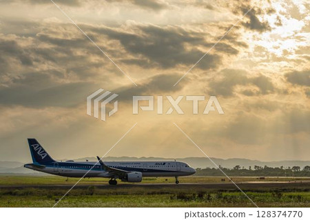 Sendai Airport at dusk, airplane taking off, Natori City, Miyagi Prefecture Sendai Airport at dusk, airplane taking off, Natori City, Miyagi Prefecture 128374770
