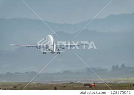 Sendai Airport at dusk, airplane taking off, Natori City, Miyagi Prefecture 128375041