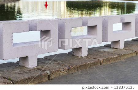Decorative concrete fencing in the bank of the river 128376123