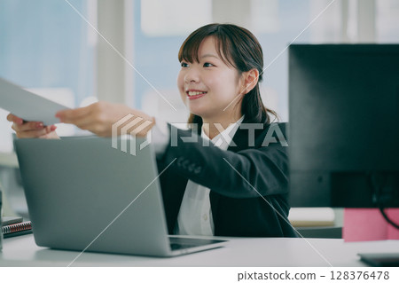 Working woman in suit 128376478