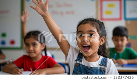 Enthusiastic student raising hand in classroom learning environment Enthusiastic student raising hand in classroom learning environment 128377426