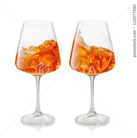 set of two glass aperol spritz cocktail splashing inside the glass isolated on white background 128377880