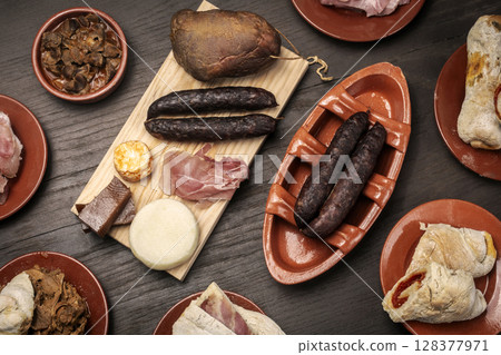 assortment of traditional Portuguese tapas snack food on restaurant table in porto portugal assortment of traditional Portuguese tapas snack food on restaurant table in porto portugal 128377971