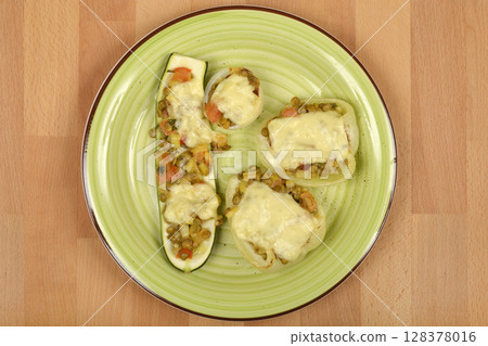 baked stuffed zucchini, bell peppers, and onions 128378016