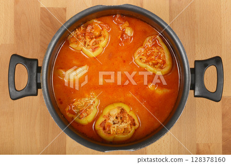 Green bell peppers stuffed with meat and rice mixture 128378160