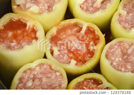 Green bell peppers stuffed with meat and rice mixture 128378188