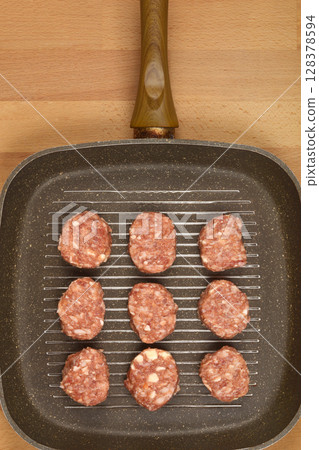 Savory minced meat and cheese patties 128378594