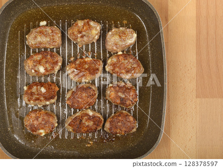 Savory minced meat and cheese patties Savory minced meat and cheese patties 128378597