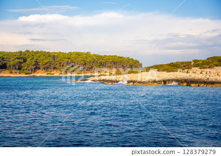 Uninhabited islands of the Lastovo National Park surrounded by calm sea in Croatia. Nature reserve, remote landscape and Mediterranean summer escape 128379279