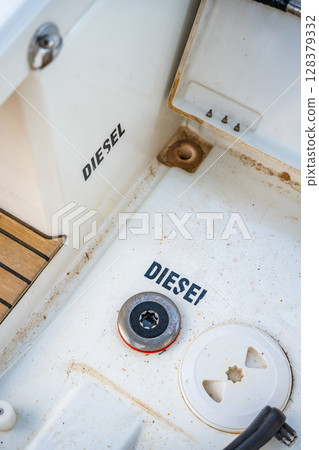Diesel fuel inlet on the deck of a sailing yacht near Croatia, marked with the word Diesel. Technical detail, maintenance and essential part of boat operation. 128379332
