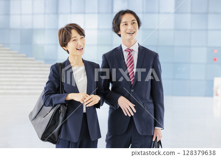A business team of men and women in suits 128379638
