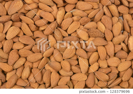 Pile of raw almonds Pile of raw almonds 128379696