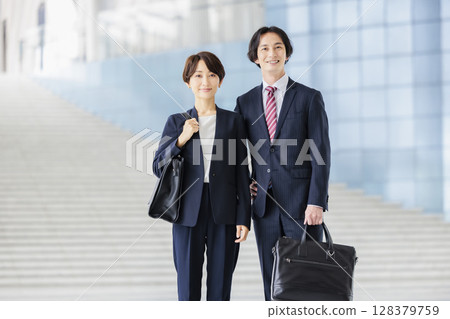 A business team of men and women in suits A business team of men and women in suits 128379759