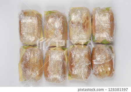 Sandwiches wrapped in clear plastic film Sandwiches wrapped in clear plastic film 128381397