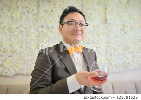 Man giving a speech at a party 128381629