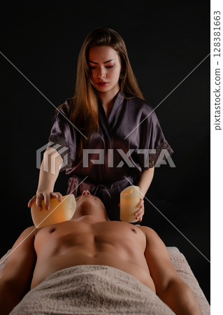 Relaxation and rejuvenation through therapeutic massage in a studio setting 128381663