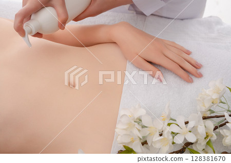 Relaxing massage session in a serene beauty studio for ultimate wellness 128381670