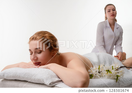 Relaxation and rejuvenation in a serene spa massage studio setting 128381674
