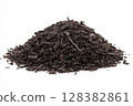 Dry black tea leaves isolated on white background. Pile of Dried fermented tea. Black Tea Leaves Heap. Close Up, Macro. Front View. Texture. Copy Space. Dried Tea. Abstract Food and Drink Backdrop. 128382861
