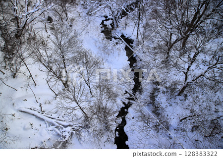 A snow-covered river 128383322