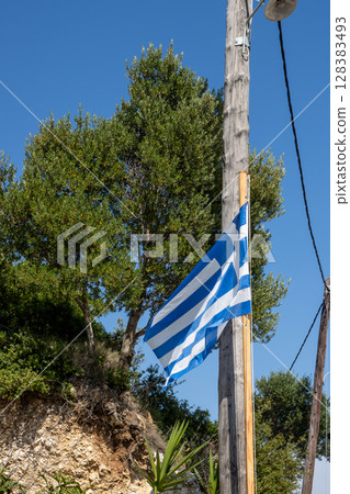 Greek flag in the nature, Corfu (Korfu), Greece Greek flag in the nature, Corfu (Korfu), Greece 128383493