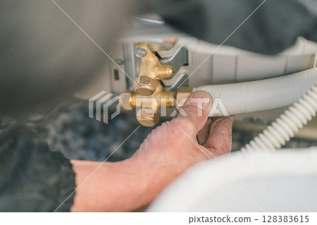 Air conditioner installation Air conditioner installation 128383615