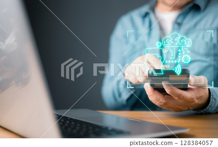 man engages with a glowing virtual interface showcasing AI, chatbot, and neural network icons, representing artificial intelligence, advanced communication, smart technology solutions in a futuristic. 128384057