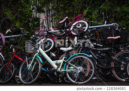 Stacked bicycles Stacked bicycles 128384081