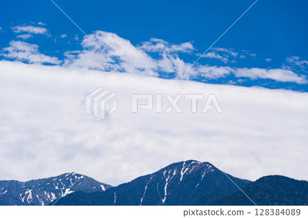White clouds and Mount Kiso-Koma 128384089