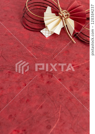 Red Japanese paper with Mizuhiki decorations - Celebratory Japanese-style background 128384237
