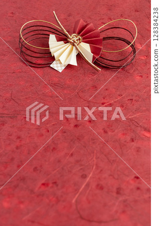 Red Japanese paper with Mizuhiki decorations - Celebratory Japanese-style background 128384238