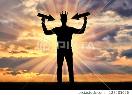 Silhouette of a selfish man with a crown on his head Silhouette of a selfish man with a crown on his head 128385026