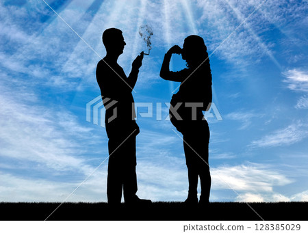 Silhouette of a man egoist smoking near a pregnant woman. She covered her nose with her hand from the smoke Silhouette of a man egoist smoking near a pregnant woman. She covered her nose with her hand from the smoke 128385029