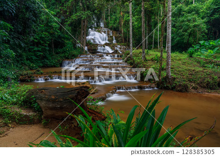 Phacharoen Waterfall Beautiful waterfall in the middle of a tropical forest in Thailand 128385305