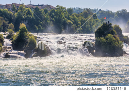 Rhine Falls or Rheinfall waterfalls, Canton Schaffhausen, Switzerland Rhine Falls or Rheinfall waterfalls, Canton Schaffhausen, Switzerland 128385346
