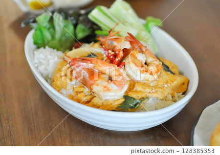 creamy omelet or omelet or omelette or fried egg with shrimp and squid or seafood omelette and rice 128385353